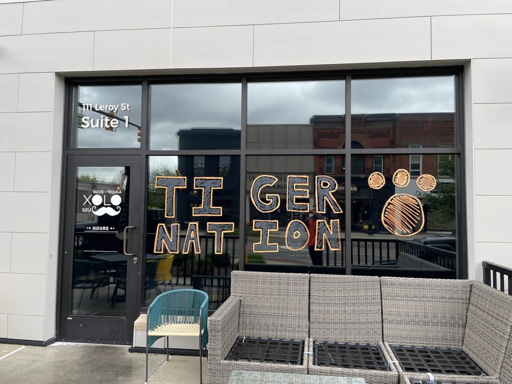 Tiger Nation painted on the windows of a local business for Fenton's Homecoming Week